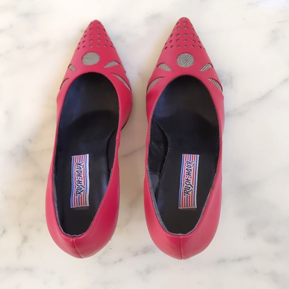 Woman's shoes with front design and  gold color heels with carved design.